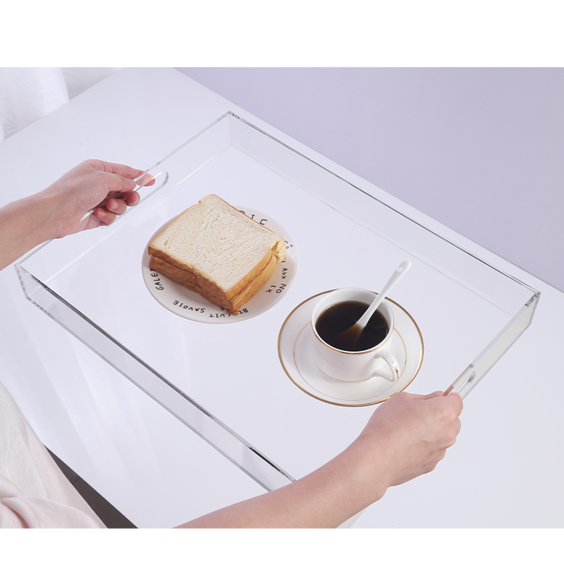 Clear acrylic serving tray in a light interior