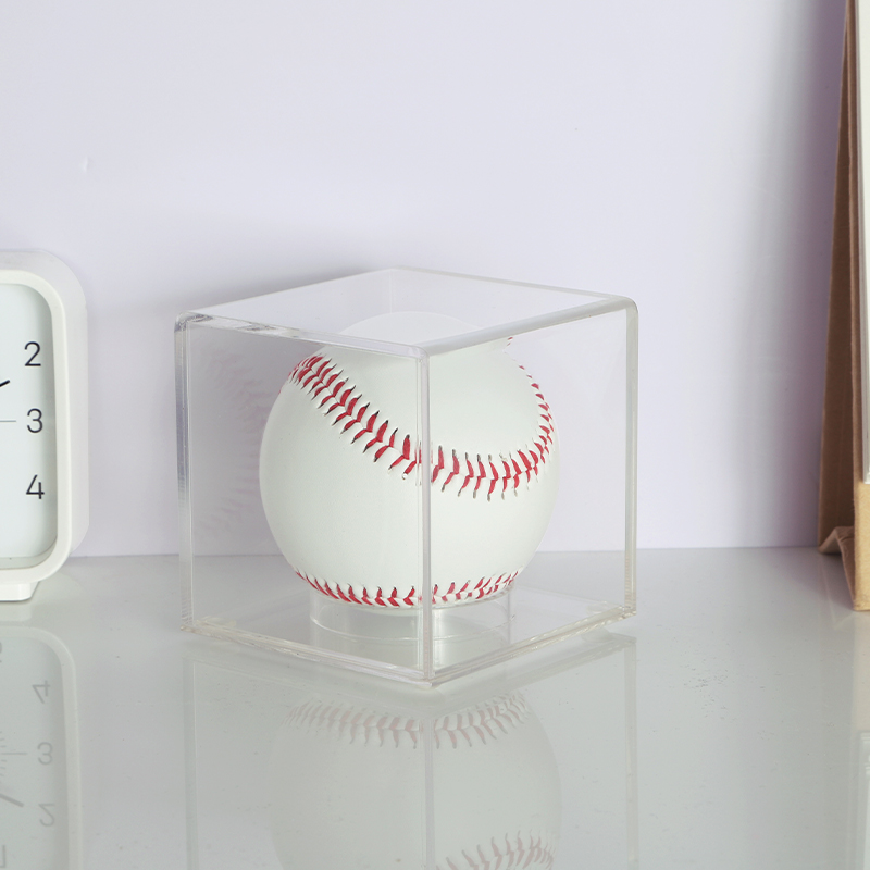 Baseball protected by a clear acrylic display case