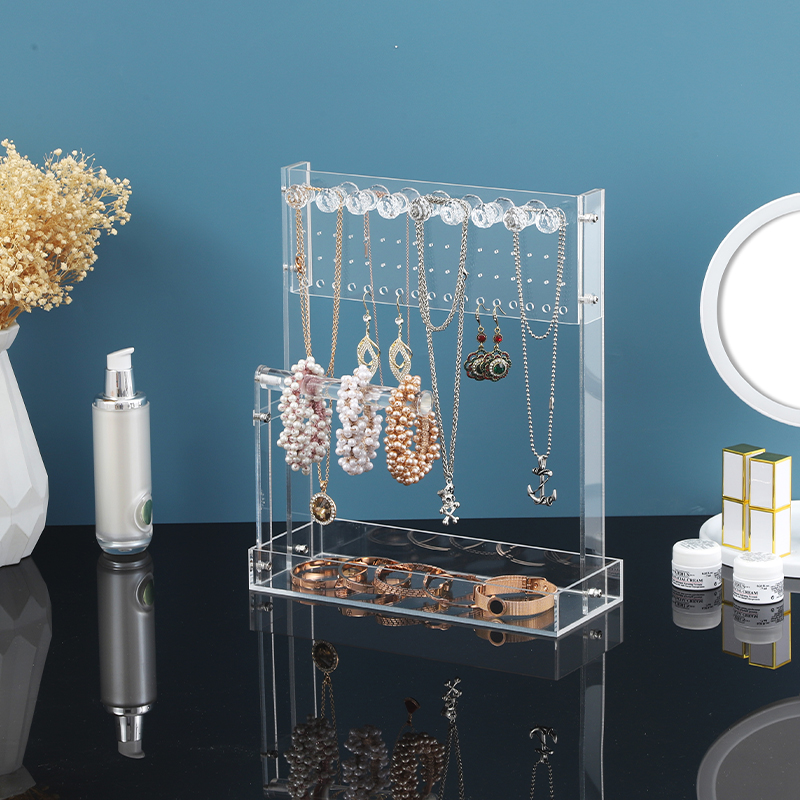 Clear acrylic jewellery organiser displayed in a styled retail setting